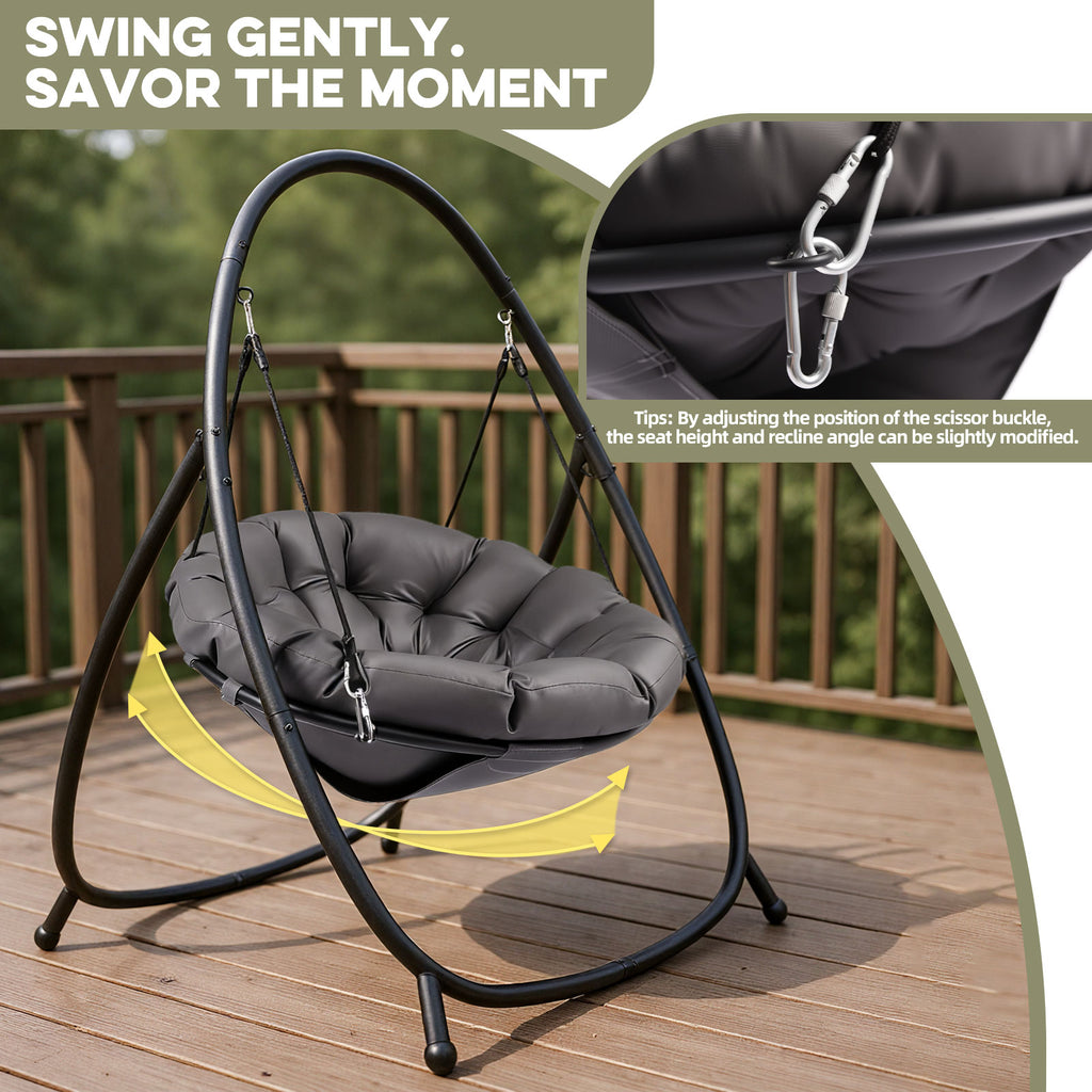Gray cushioned swing chair on a wooden deck with text 'Swing Gently, Savor The Moment