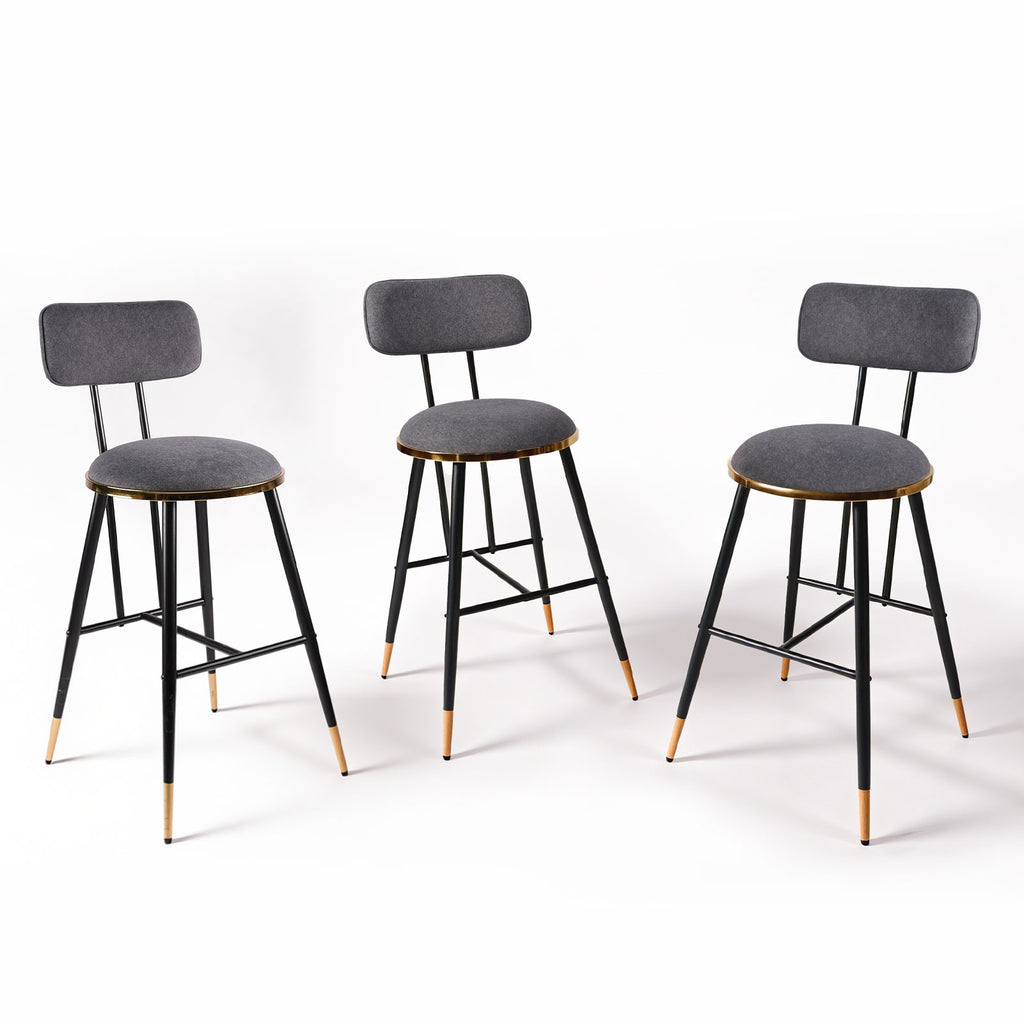 Three bar stools with gray seats and black metal frames on a white background