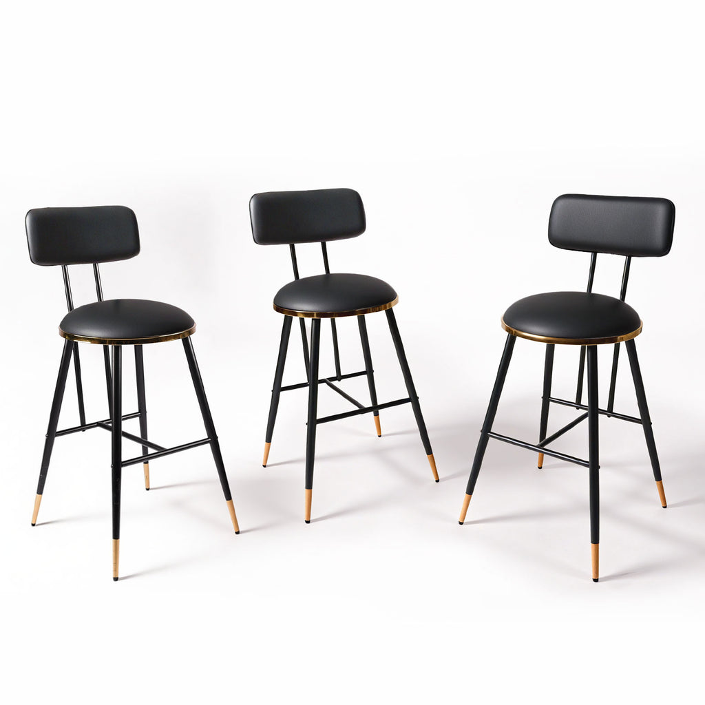 Three black bar stools with gold accents on a white background