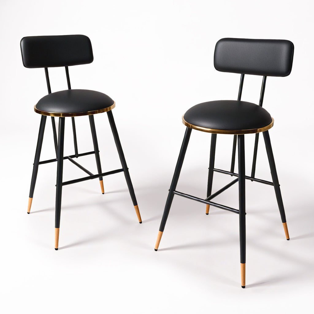 Two black bar stools with Golden accents on a white background